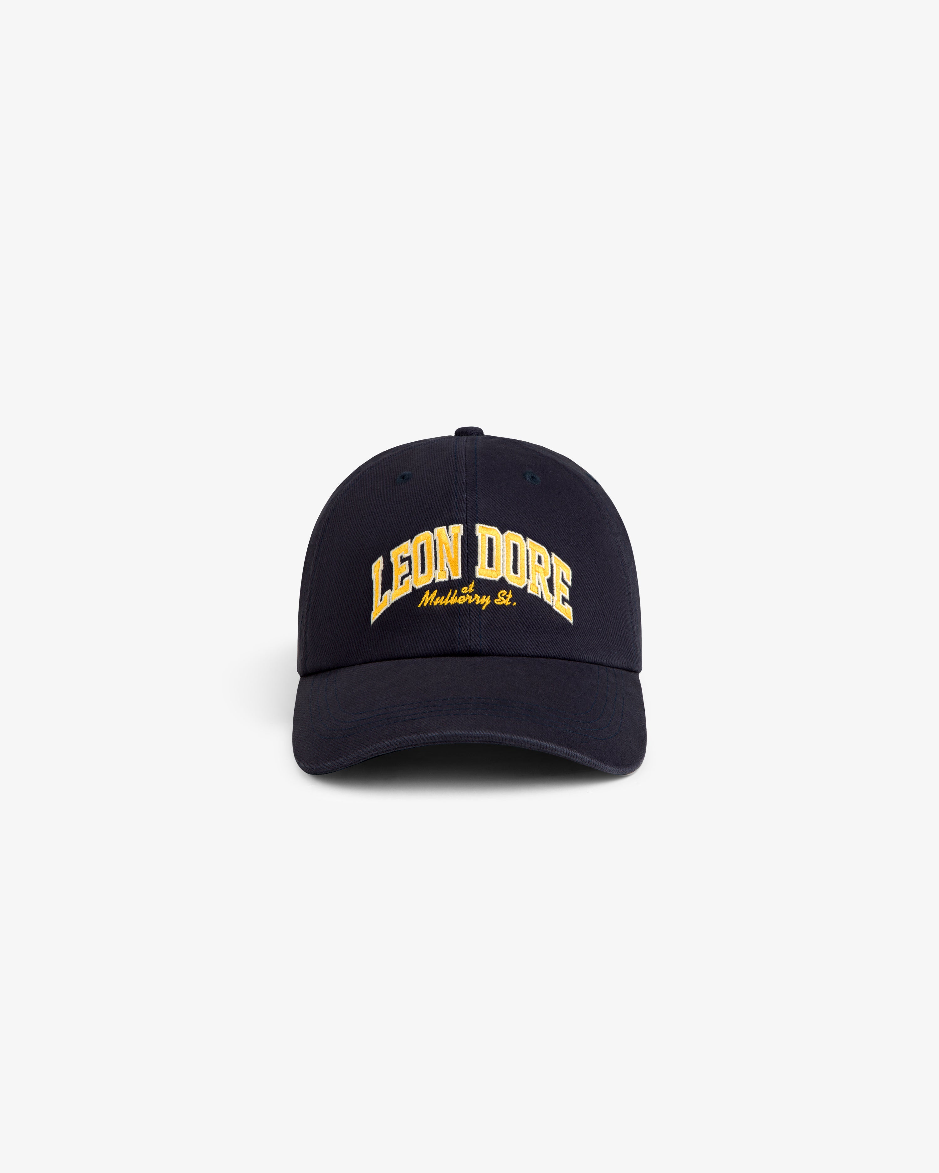Mulberry Letterman Hat in navy, with yellow LEON DORE and white Mothing St. text, on a white background.