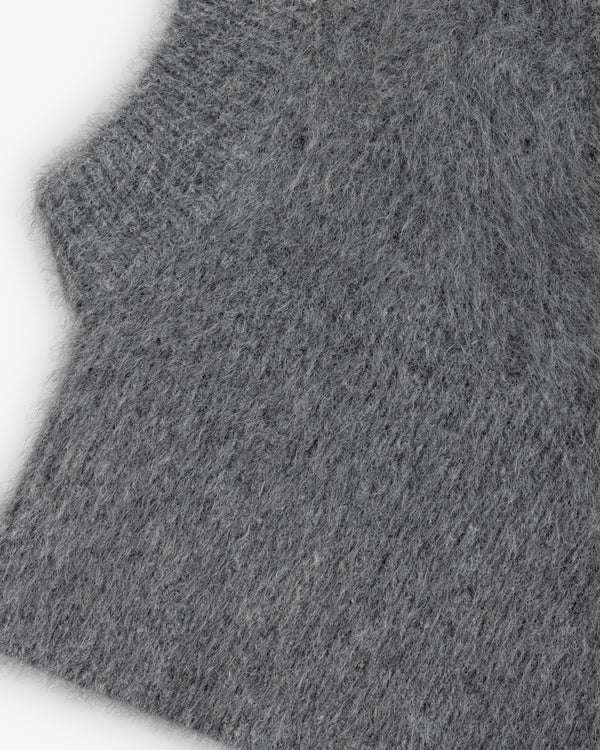 Close-up of a grey, fuzzy, textured knit Fox Fur Hood.