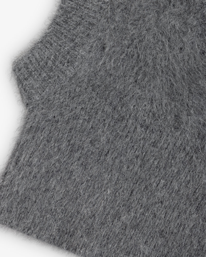 Close-up of a grey, fuzzy, textured knit Fox Fur Hood.