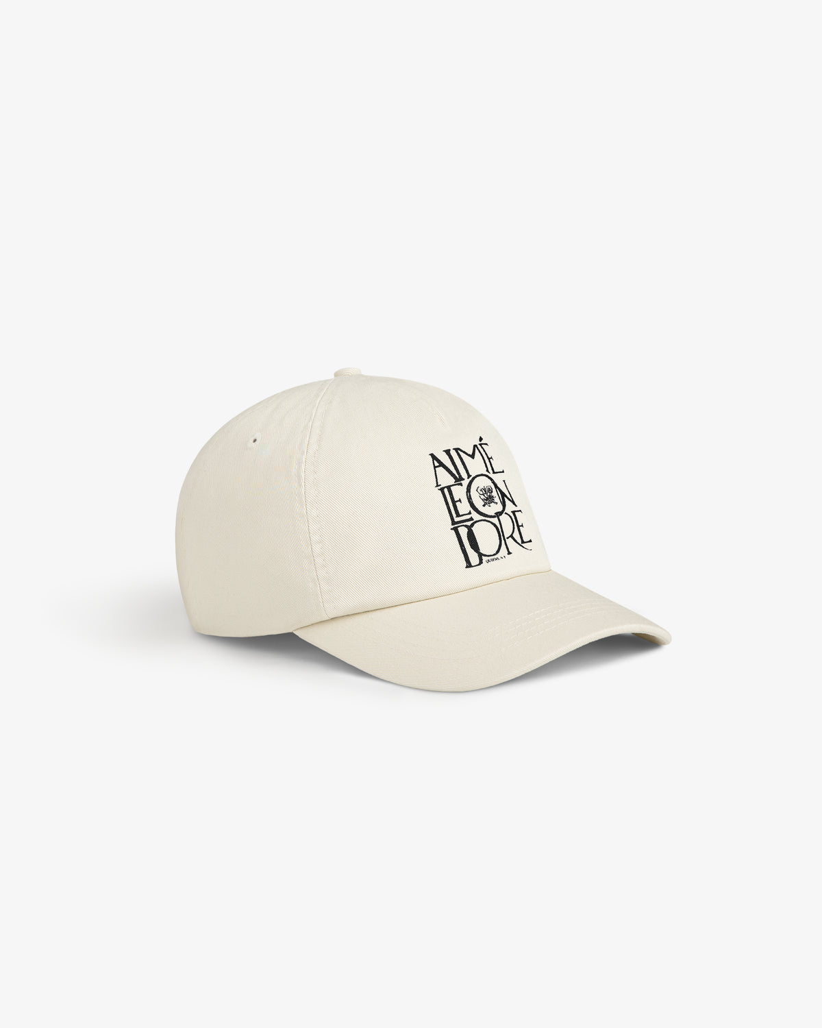 A beige Stacked Logo Hat with AIMÉ LEON DORE and a small black sun graphic printed on the front.