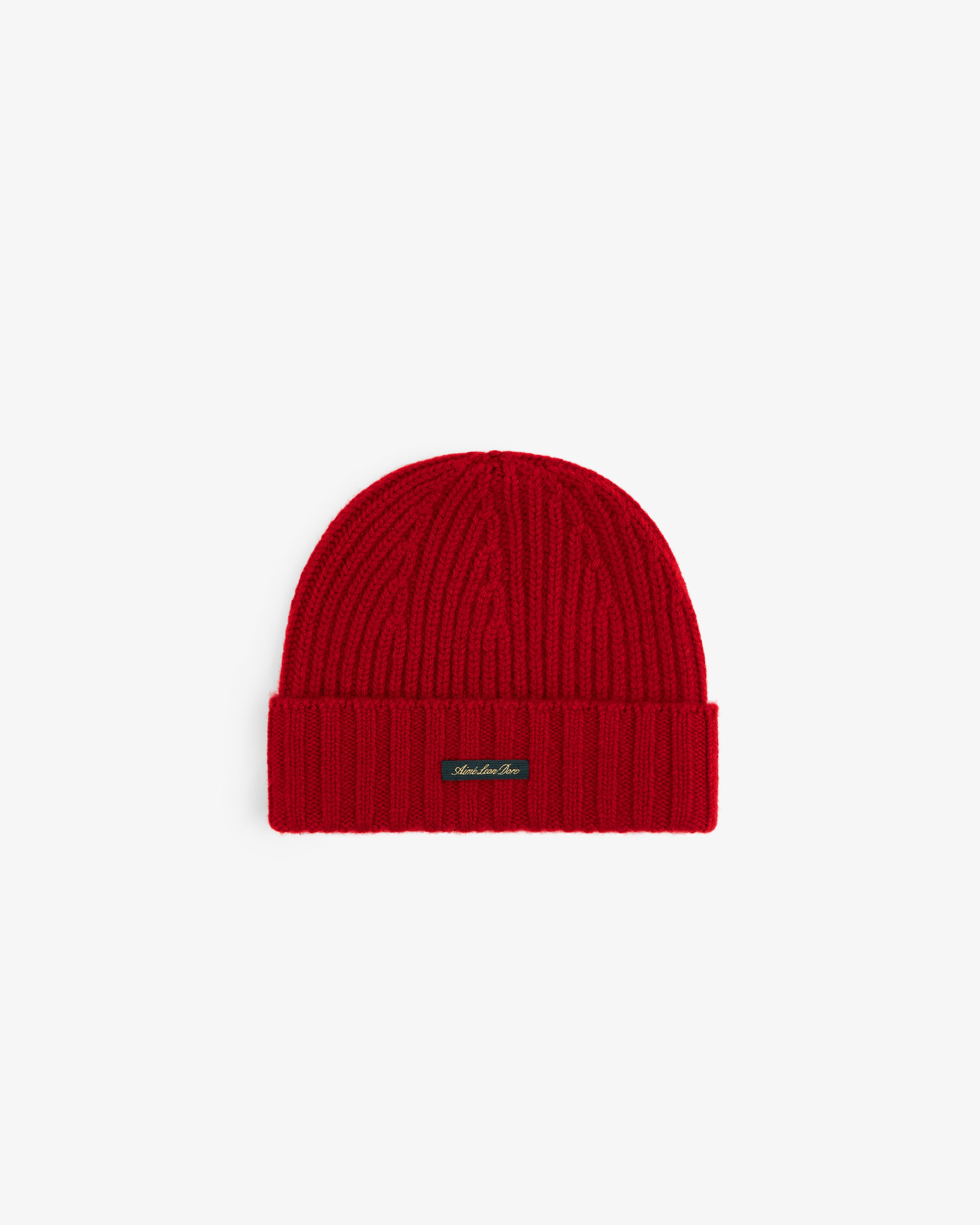 Ribbed red Cashmere Beanie with a folded cuff and a small rectangular logo tag.