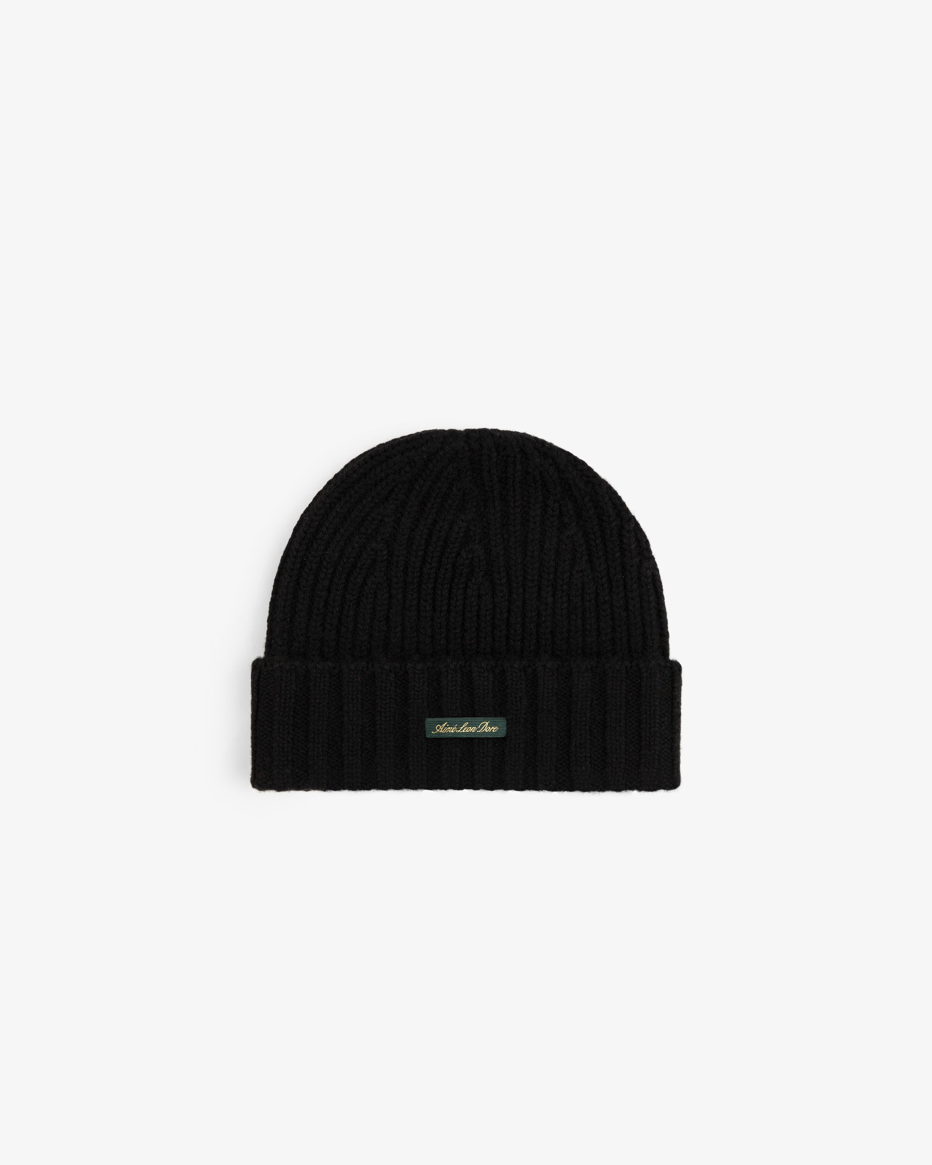 Black ribbed Cashmere Beanie with a folded cuff and a small rectangular logo tag.