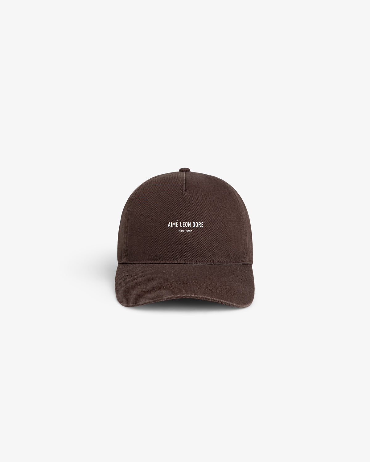 A brown Micro Logo Hat with white AIMÉ LEON DORE NEW YORK text on the front, shown on a white background.