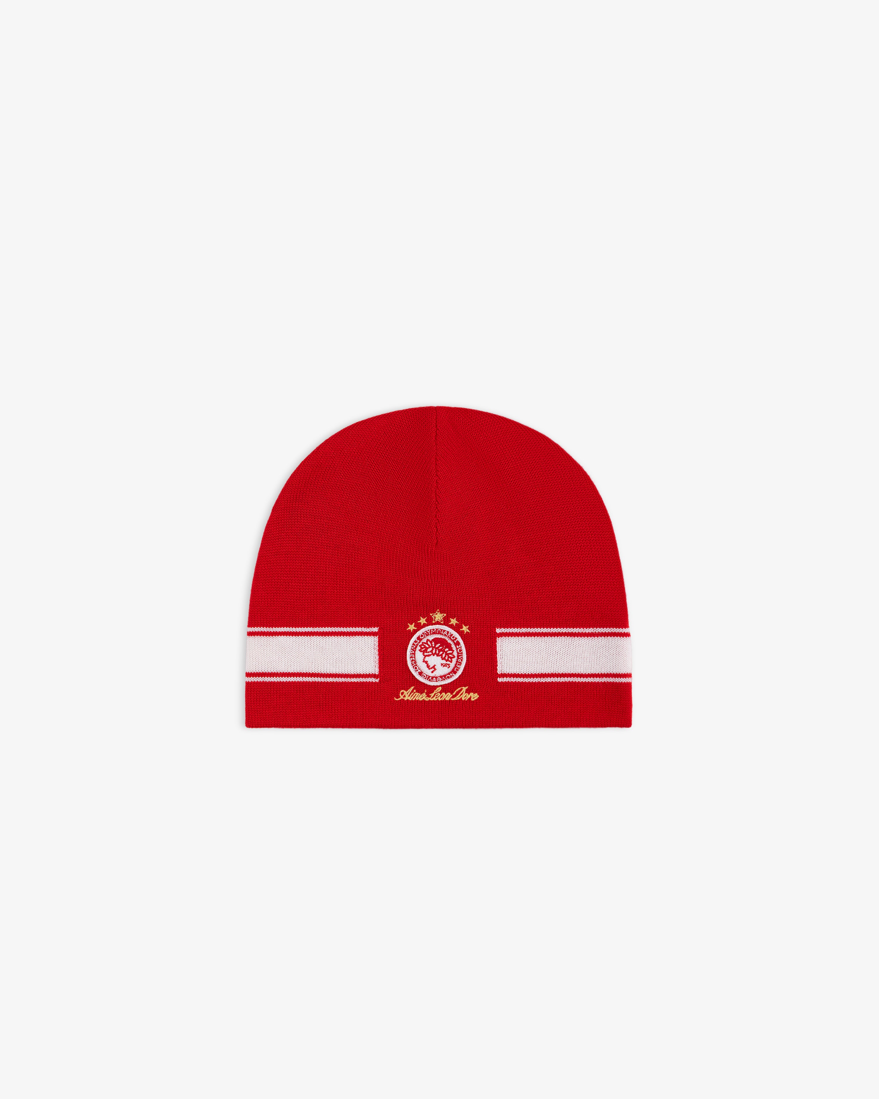 ALD / Olympiacos F.C. Stadium Beanie, a red beanie with a white horizontal stripe and a circular red and gold team emblem.
