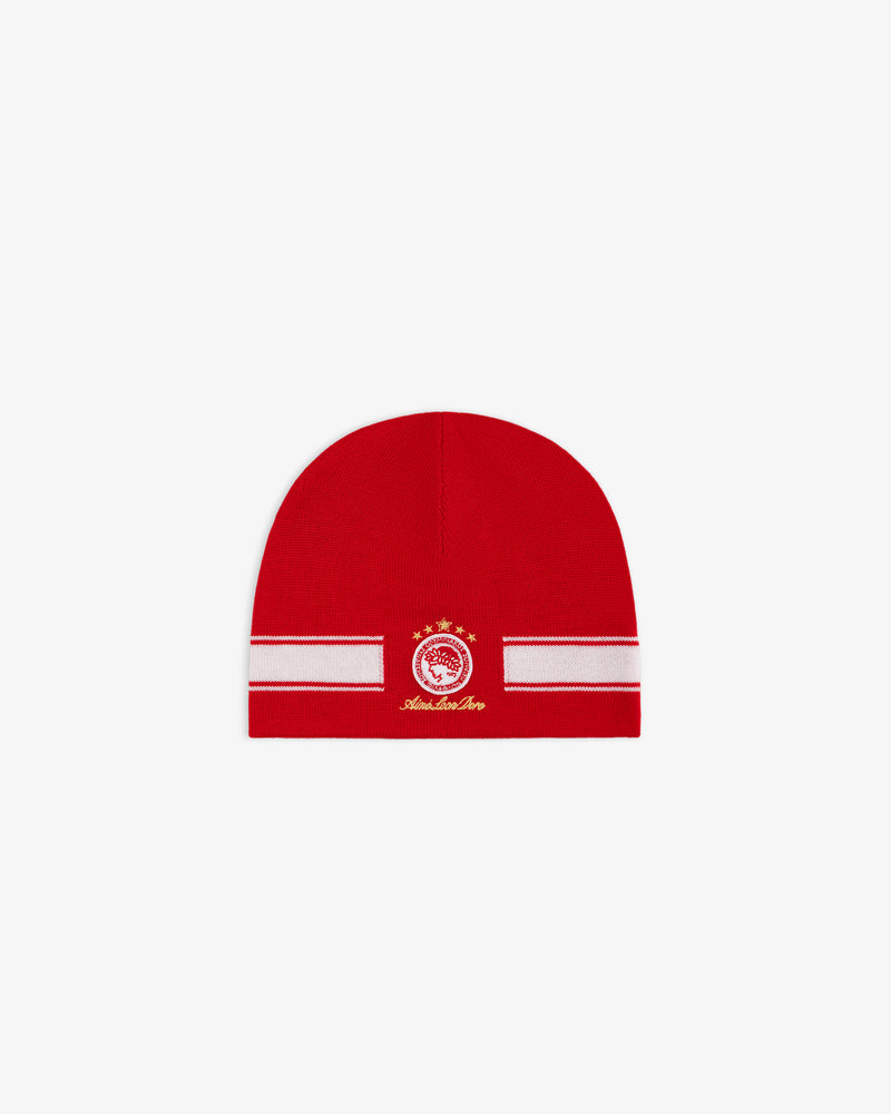 ALD / Olympiacos F.C. Stadium Beanie, a red beanie with a white horizontal stripe and a circular red and gold team emblem.