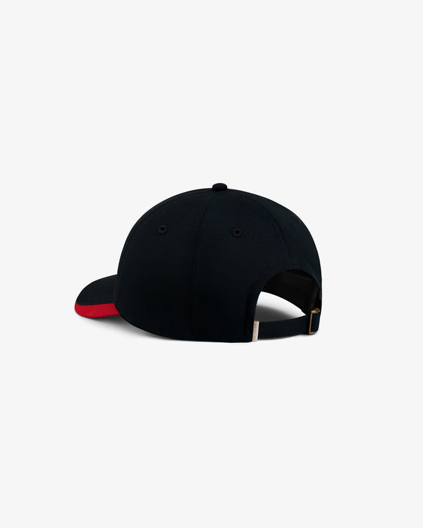 Black ALD / Olympiacos F.C. Souvenir Hat with a red accent on the brim and an adjustable metal back strap.