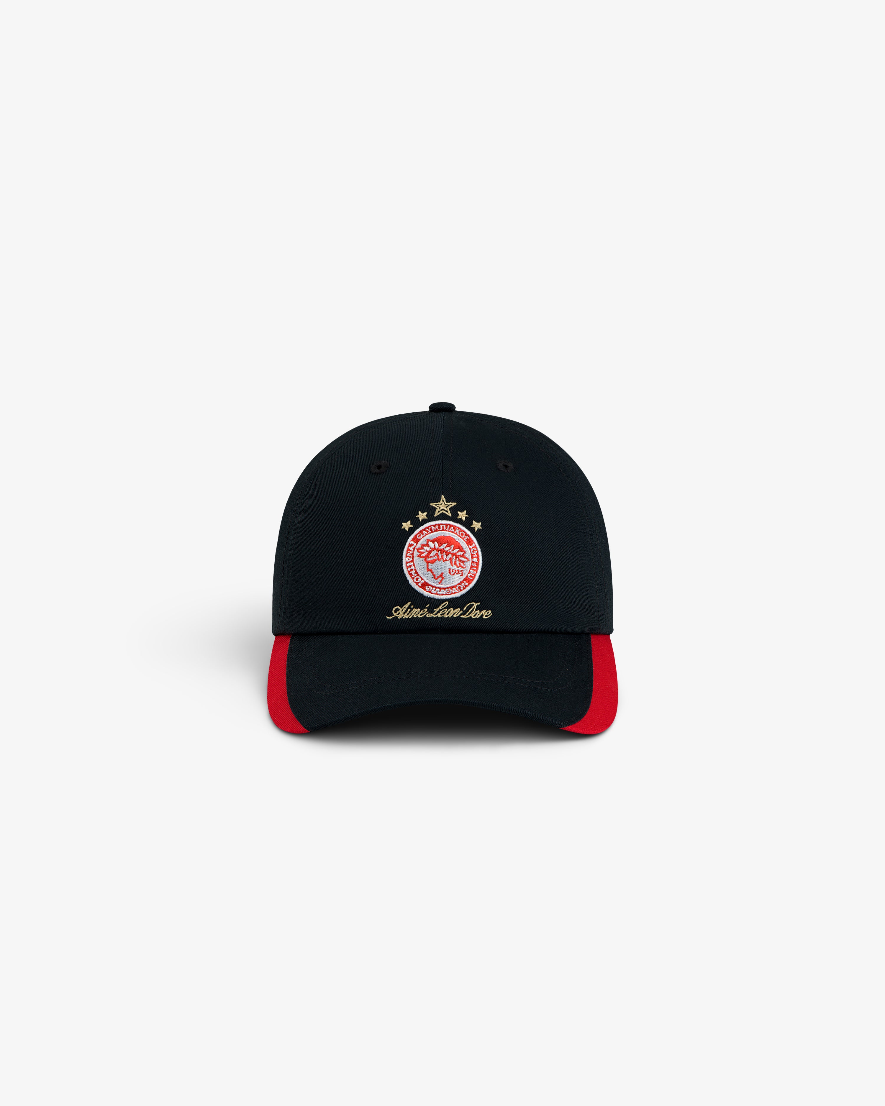 ALD / Olympiacos F.C. Souvenir Hat, a black baseball cap featuring a red and white crest and red trim on the brim.
