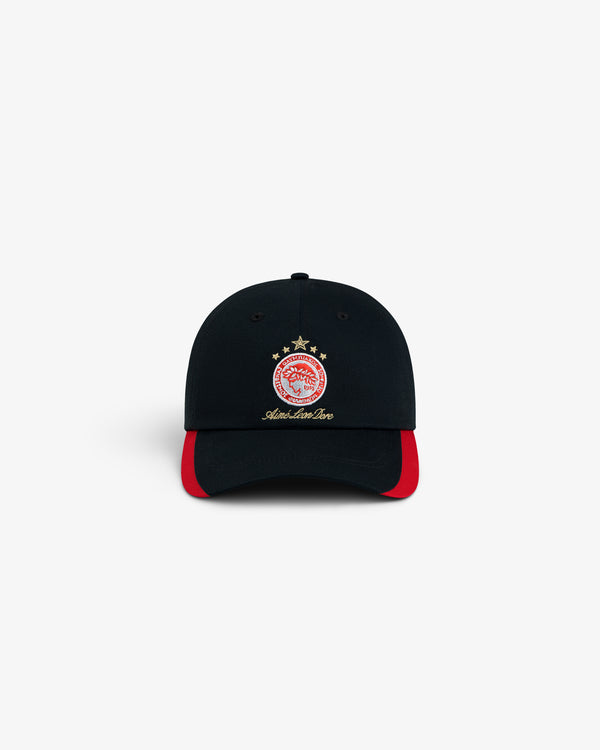 ALD / Olympiacos F.C. Souvenir Hat, a black baseball cap featuring a red and white crest and red trim on the brim.