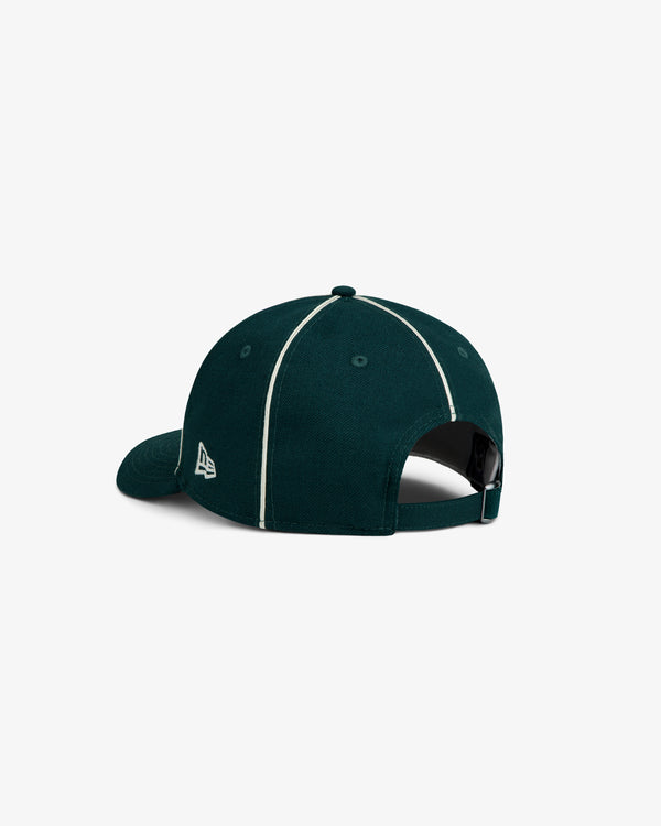 ALD / New Era Dodgers Wool Hat in dark green with white piping along the seams and an adjustable strap back.