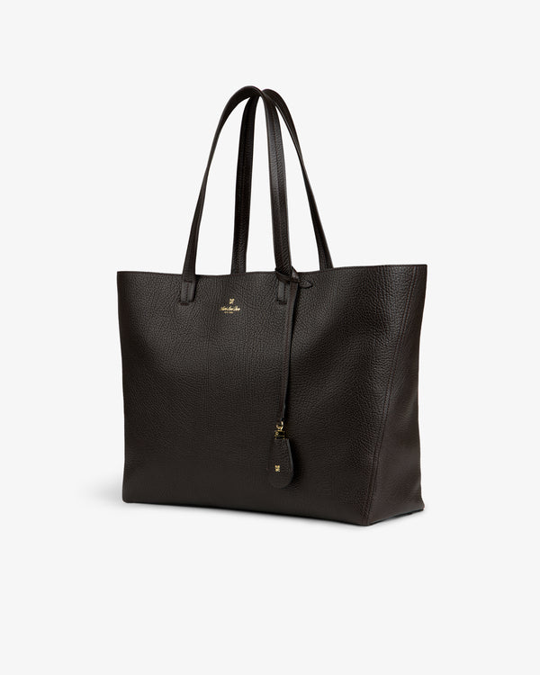 Tumbled Leather Tote Bag in dark brown with two handles and a hanging tag, shown on a plain white background.