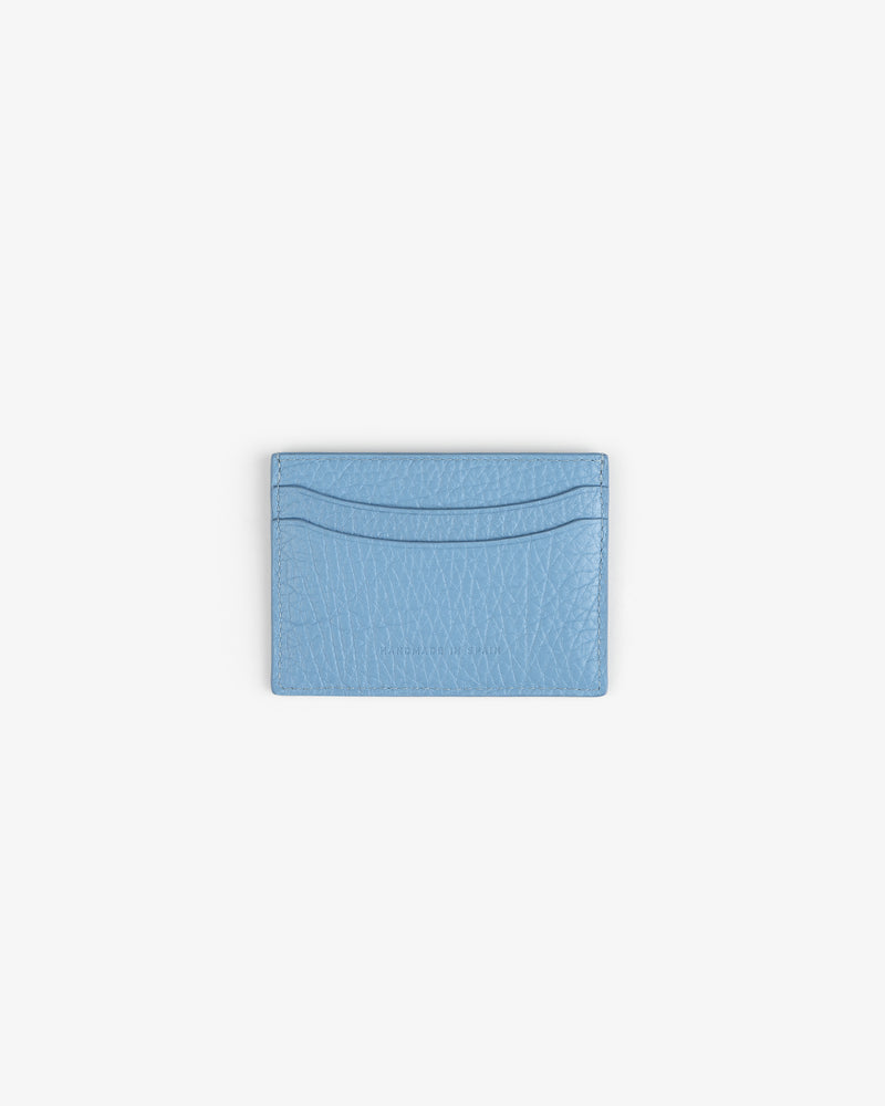 Tumbled Leather Card Holder in light blue with two slots, shown on a plain white background.
