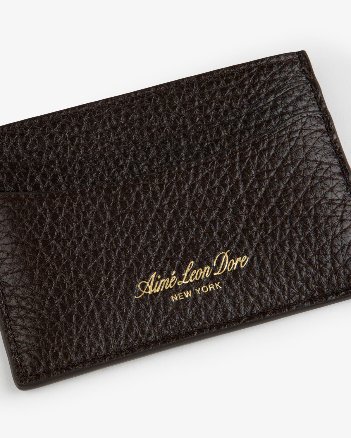 Tumbled Leather Card Holder in textured dark brown leather with Aimé Leon Dore New York gold lettering.