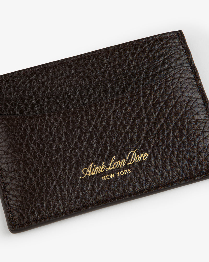 Tumbled Leather Card Holder in textured dark brown leather with Aimé Leon Dore New York gold lettering.