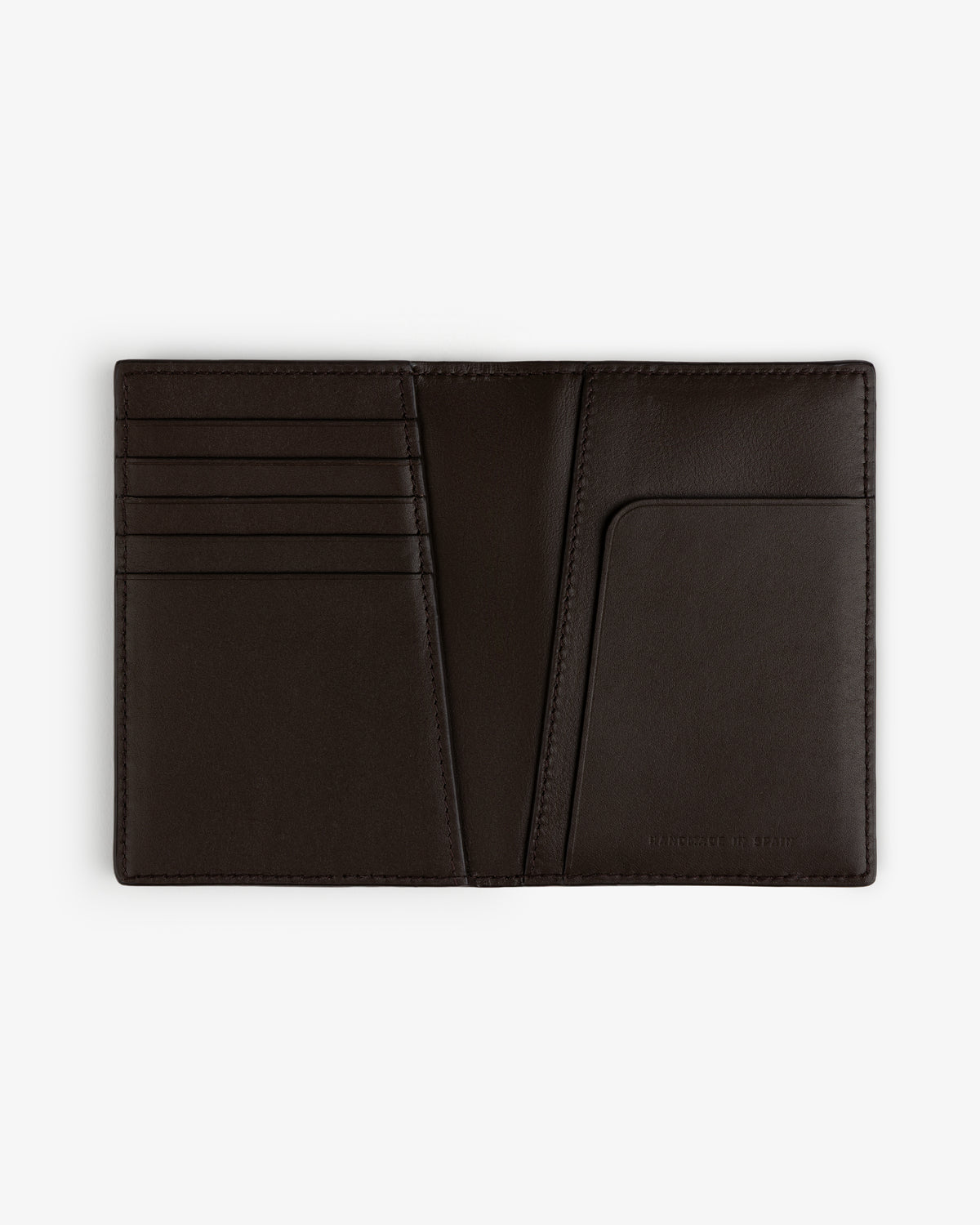 The Tumbled Leather Passport Holder in dark brown, with card slots and pocket, displayed on a white background.