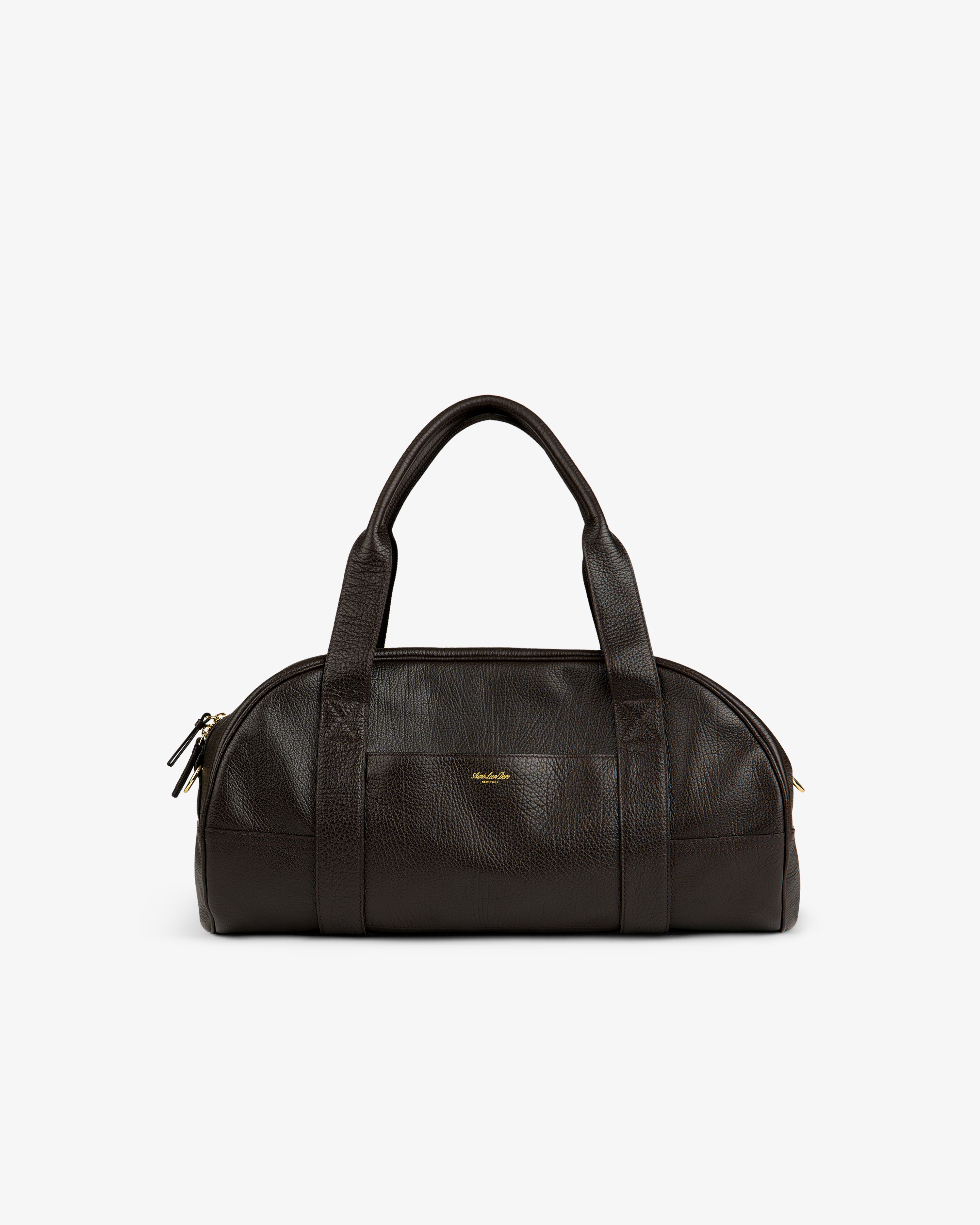 Tumbled Leather Duffle in dark brown with dual handles, gold zippers, and a small gold front logo.