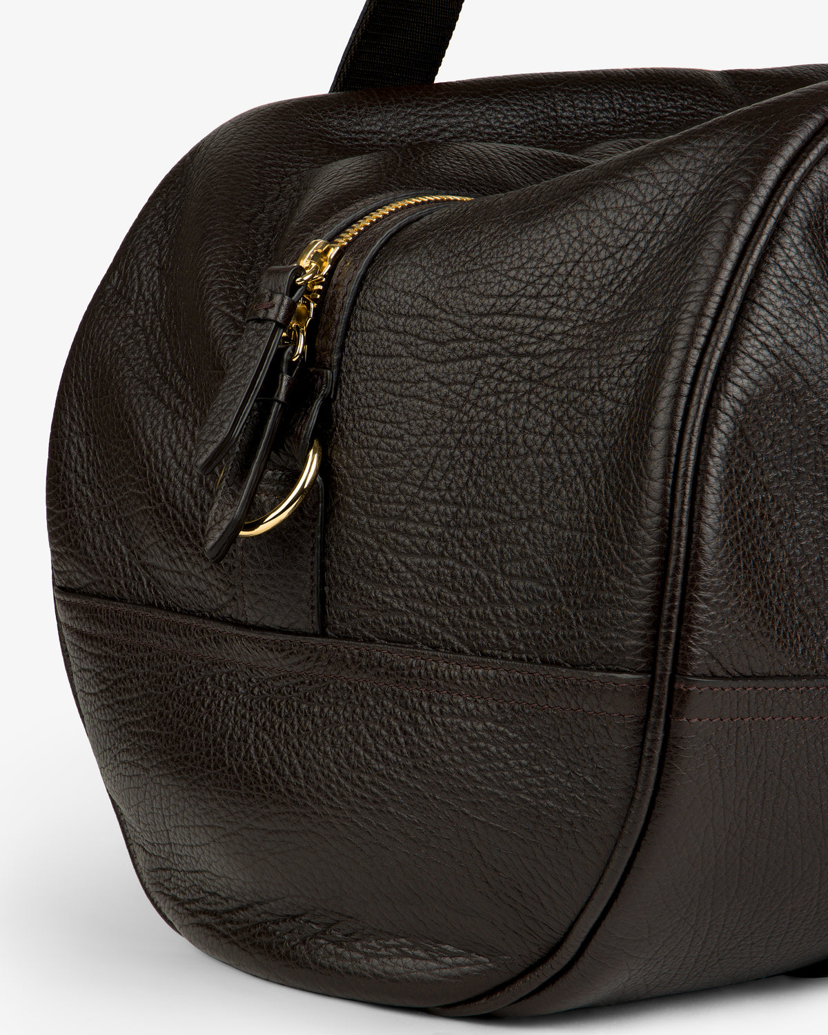 Close-up of the Tumbled Leather Duffle in dark brown with textured leather, gold zipper, and visible stitching.