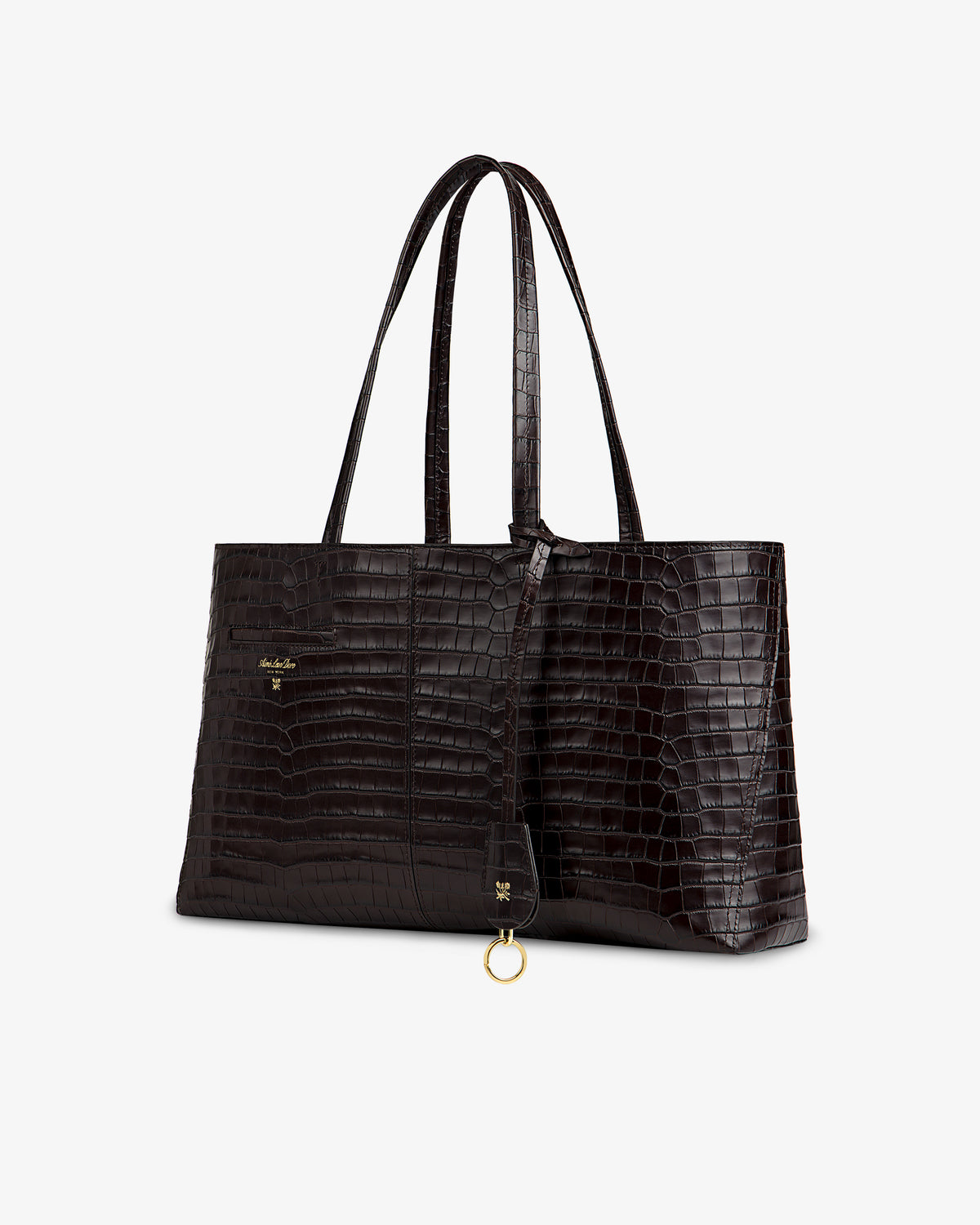 Croc-Embossed Leather Shoulder Bag in dark brown with thin straps and a gold circular charm.