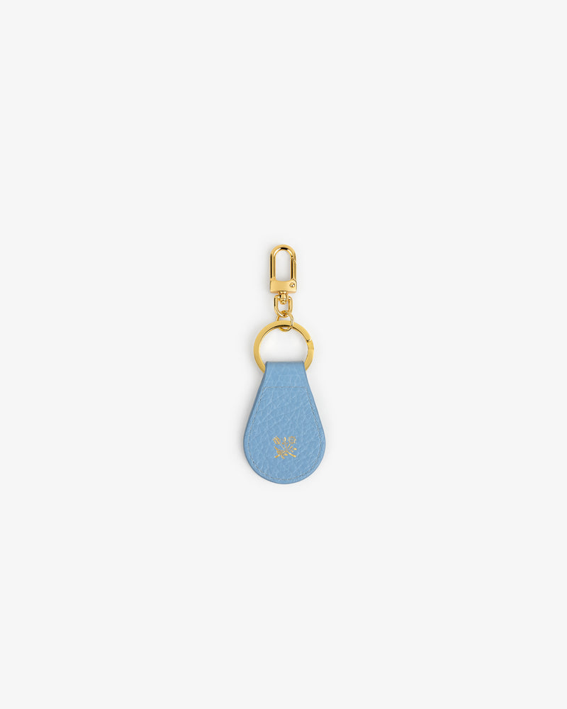 Tumbled Leather Key Fob in light blue with gold clasp and ring, shown on a white background.