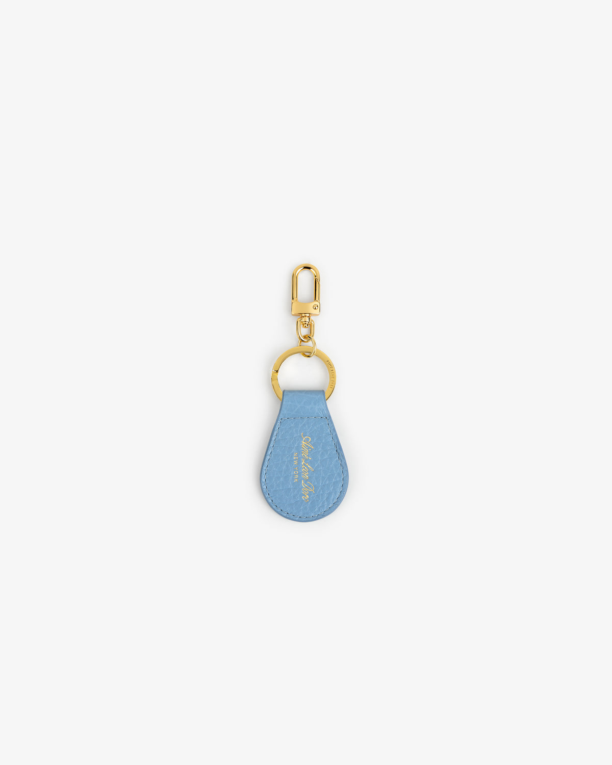 Tumbled Leather Key Fob with a light blue teardrop tag and gold keyring on a white background.