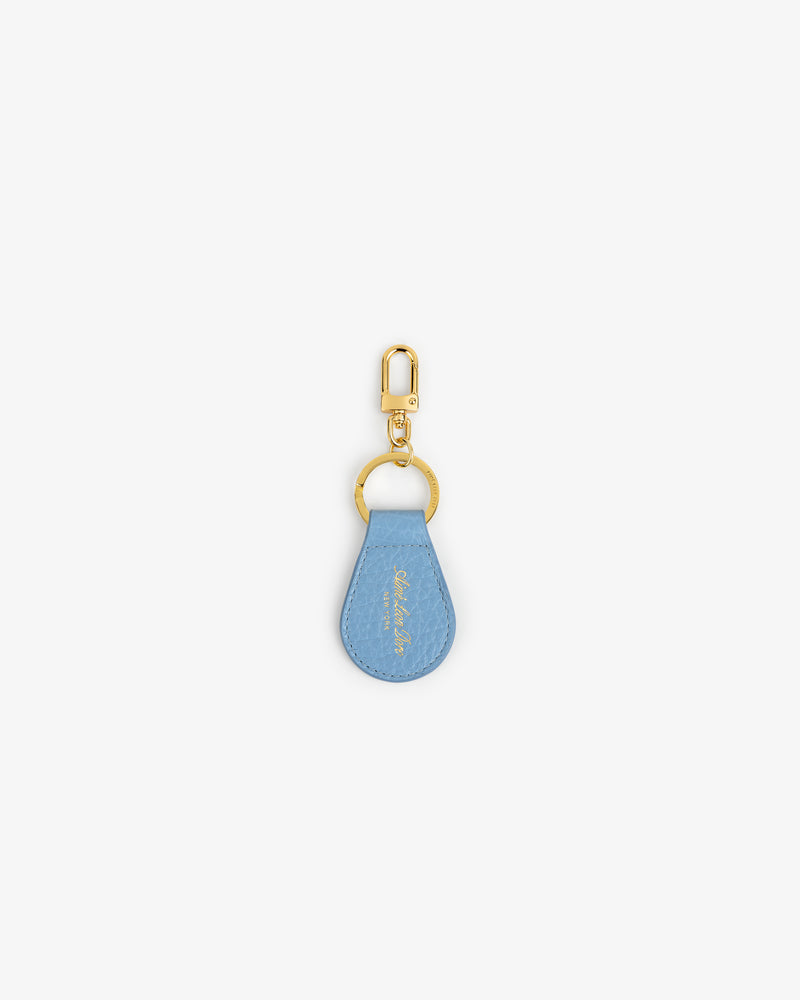Tumbled Leather Key Fob with a light blue teardrop tag and gold keyring on a white background.
