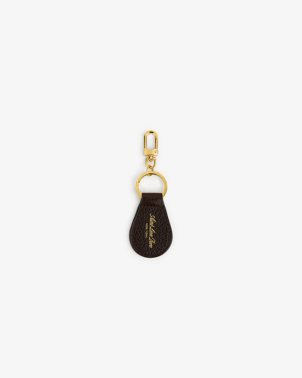 Tumbled Leather Key Fob in brown with gold hardware and cursive text, shown on a white background.