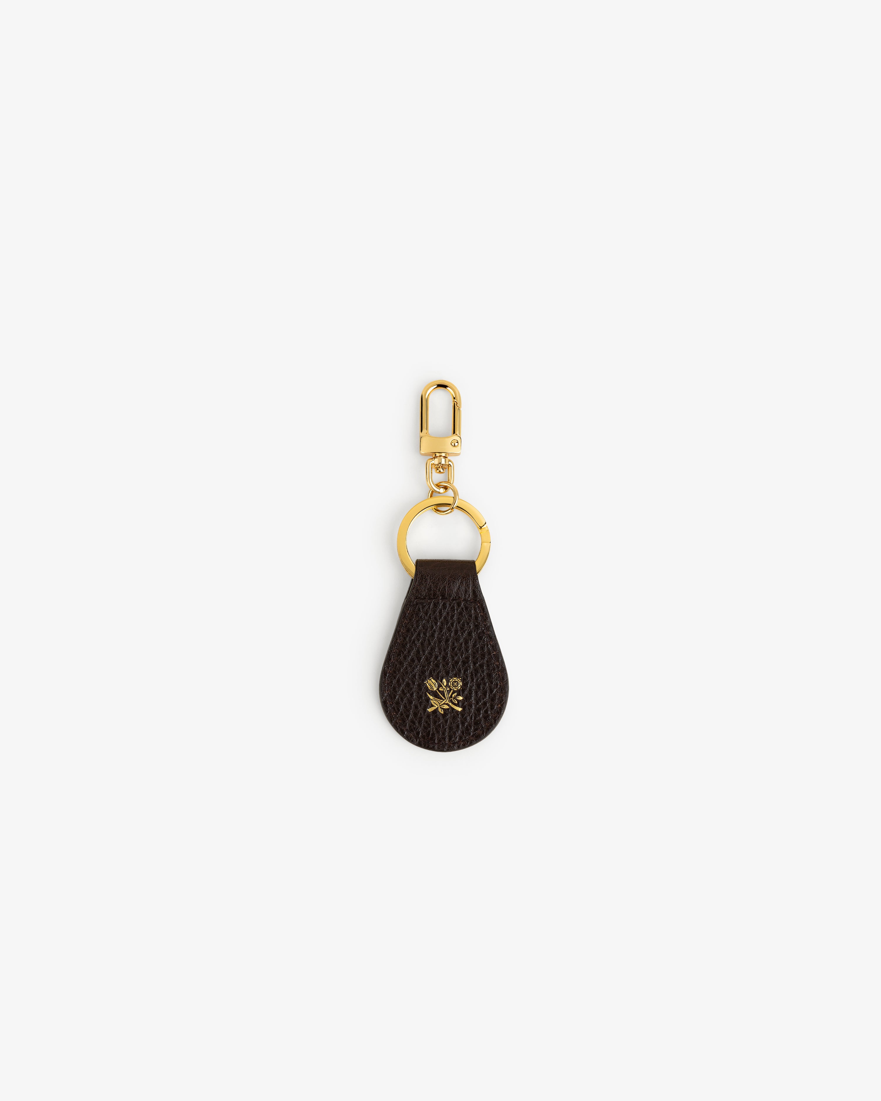Tumbled Leather Key Fob: dark brown leather, gold clip & keyring, gold floral emblem on the leather.