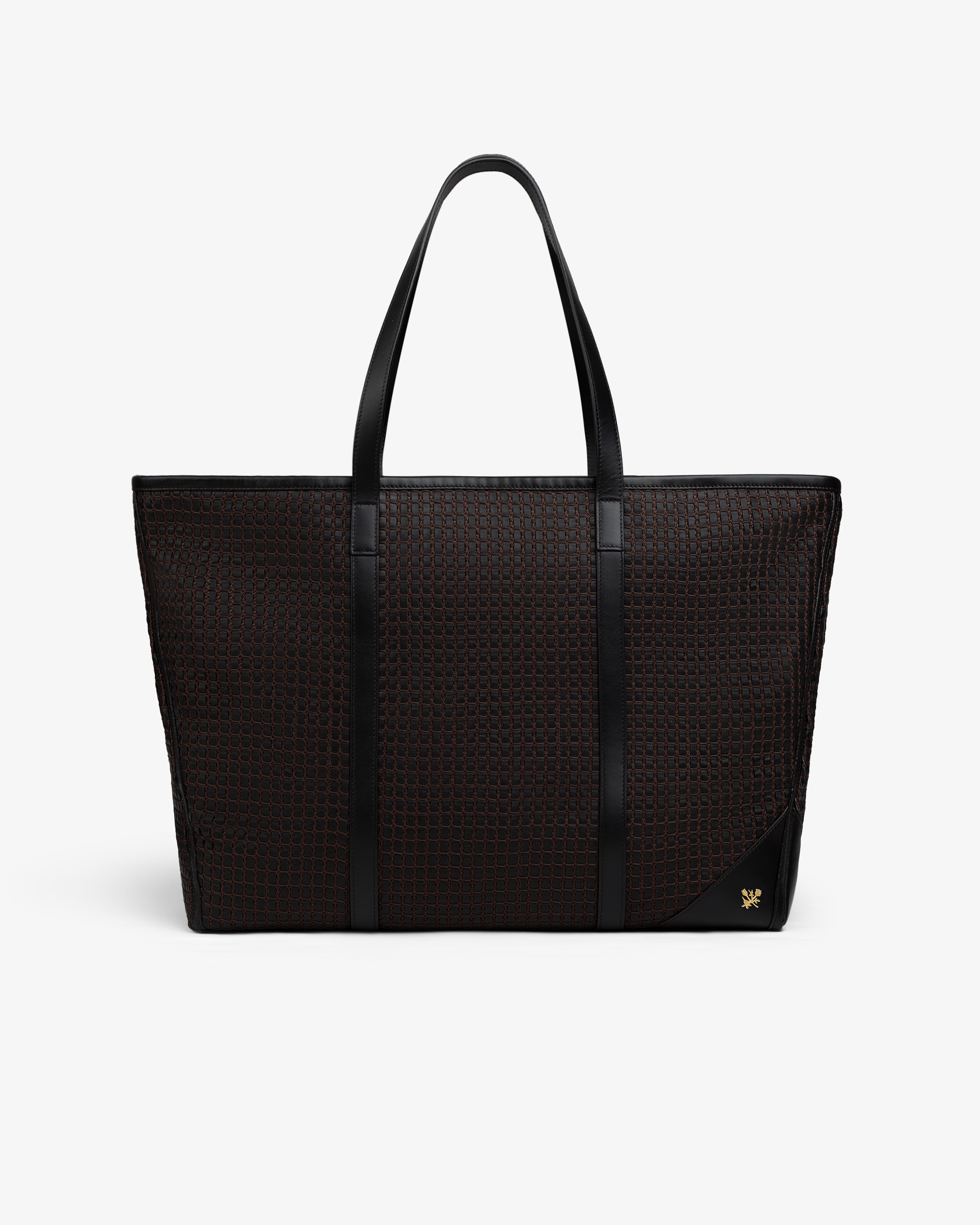 Black Woven Leather Tote Bag with smooth leather trim and a small gold emblem on the bottom corner.