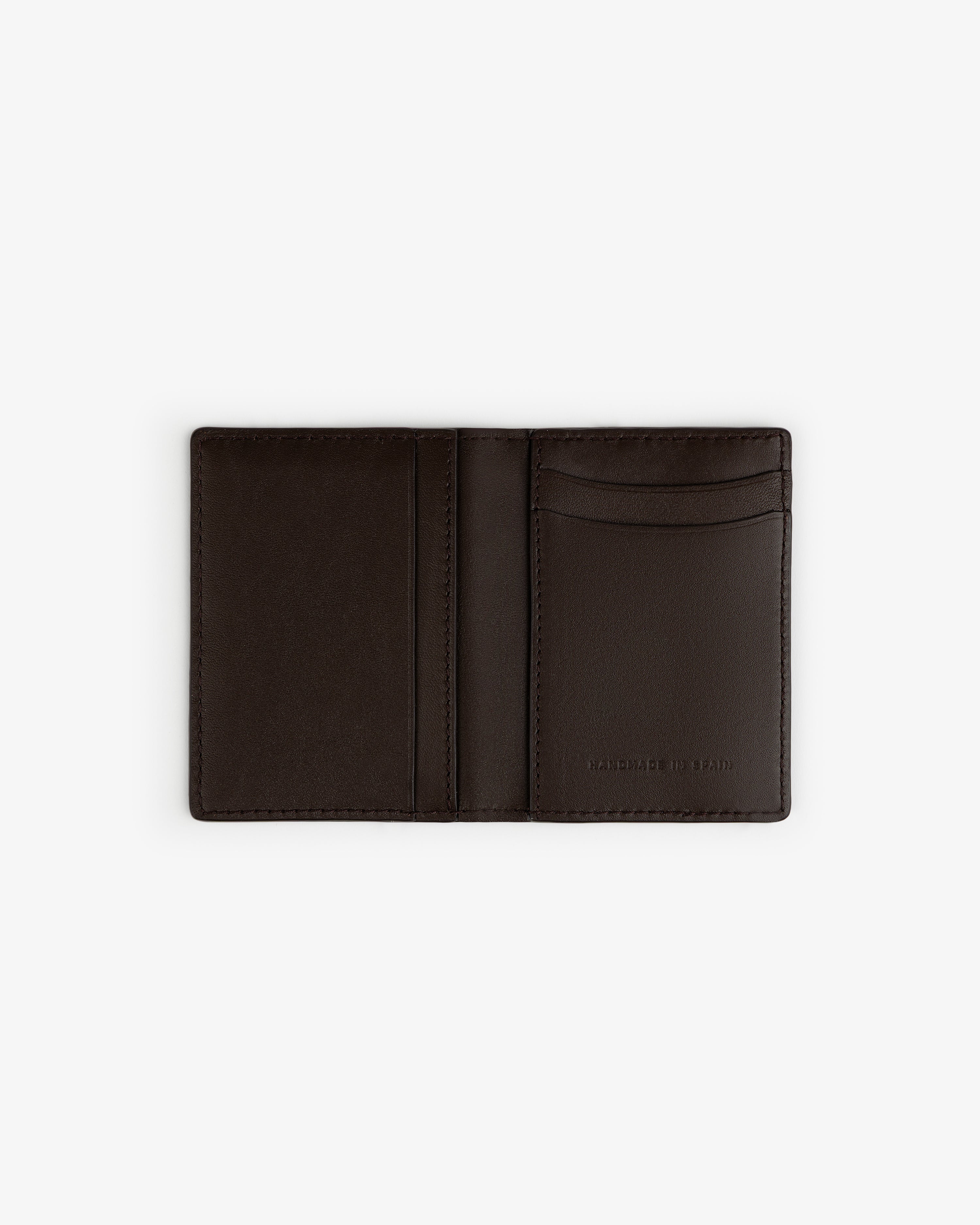 Tumbled Leather Bi-Fold Wallet in dark brown, open to show card slots and MADE IN ITALY stamp, on white background.