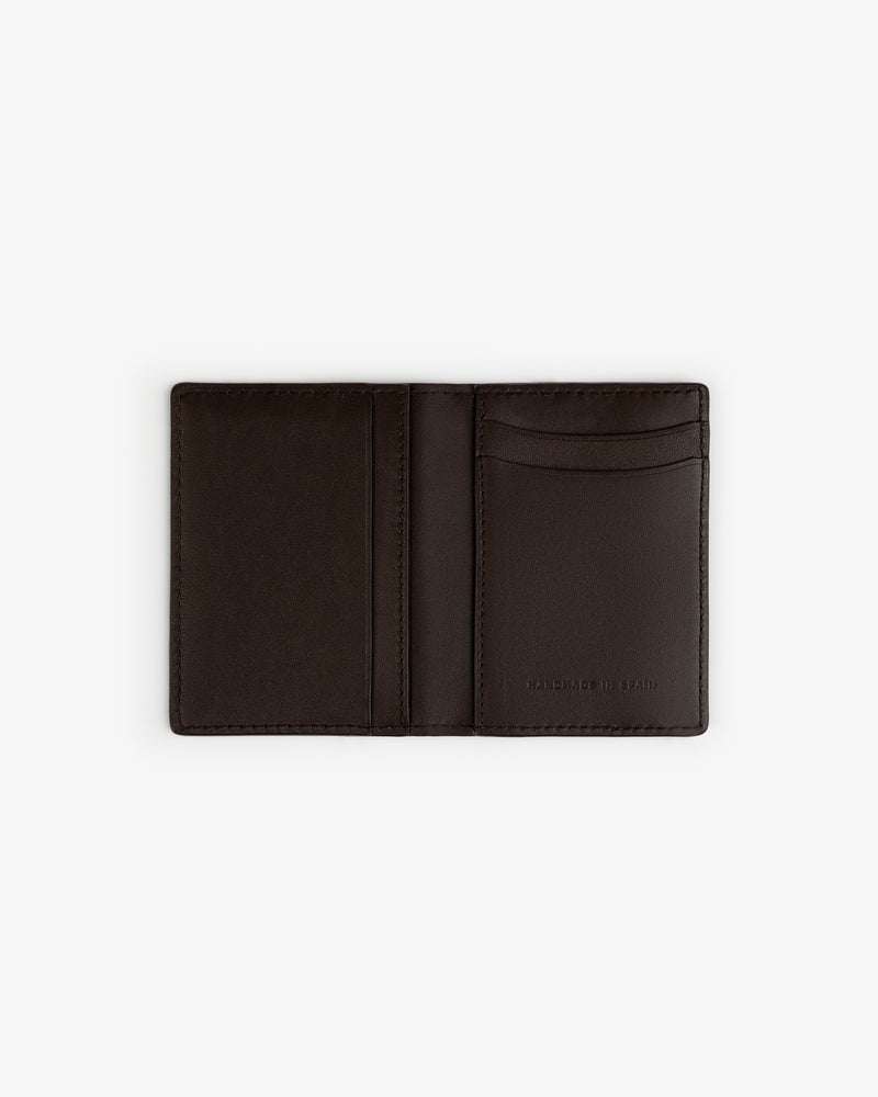 Tumbled Leather Bi-Fold Wallet in dark brown, open to show card slots and MADE IN ITALY stamp, on white background.