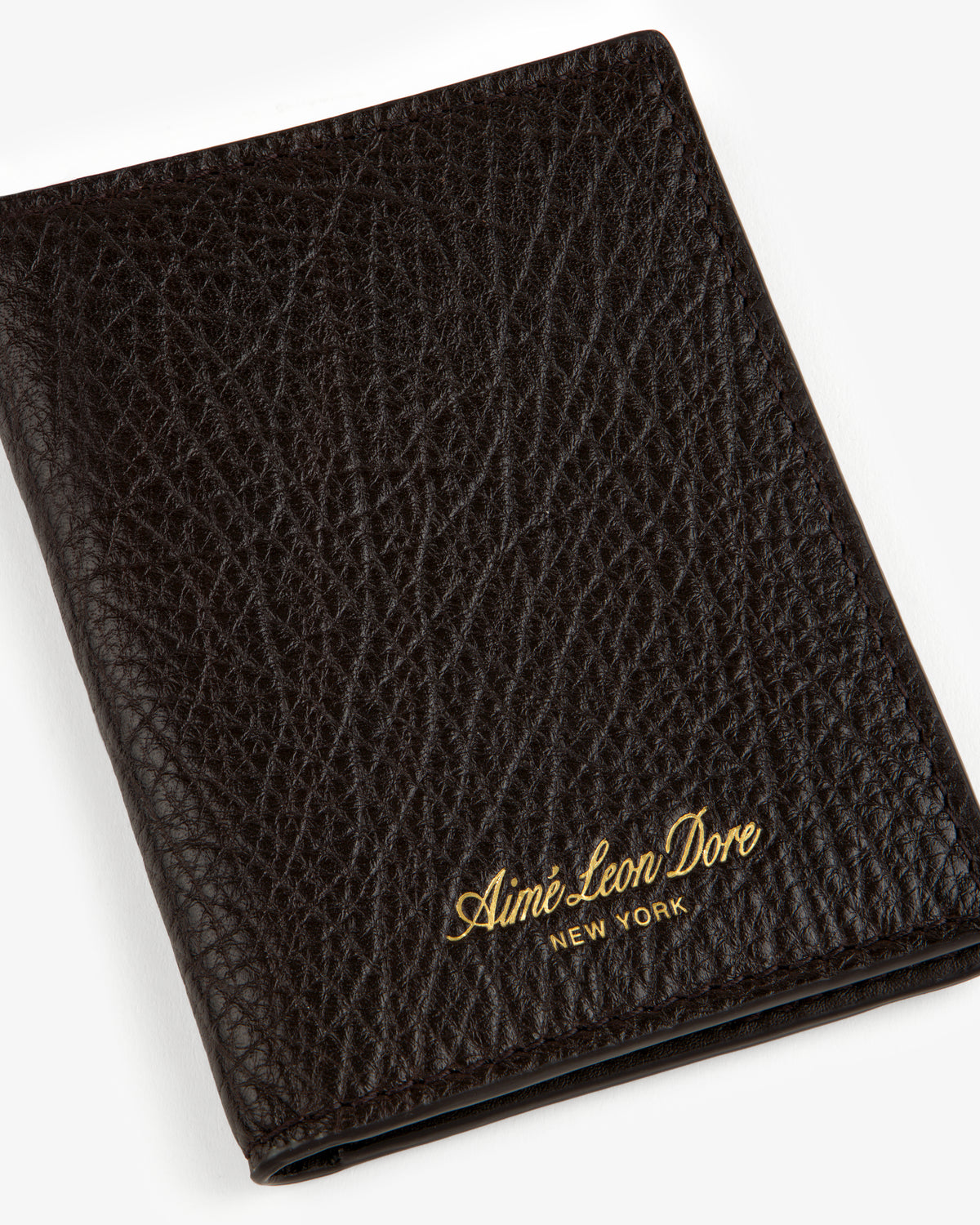 Tumbled Leather Bi-Fold Wallet in black with gold Aimé Leon Dore New York logo embossed on the bottom right.