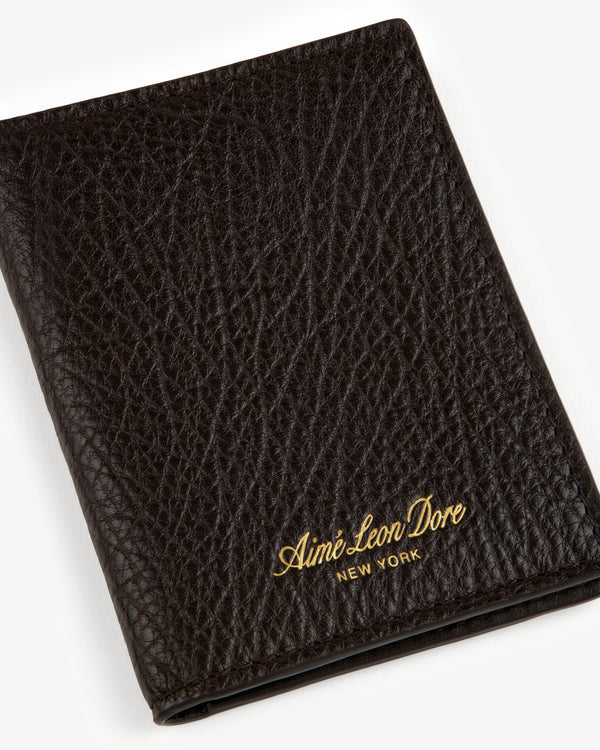 Tumbled Leather Bi-Fold Wallet in black with gold Aimé Leon Dore New York logo embossed on the bottom right.