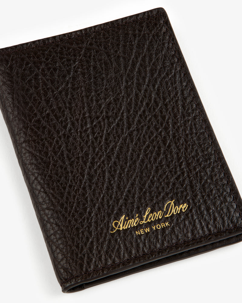 Tumbled Leather Bi-Fold Wallet in black with gold Aimé Leon Dore New York logo embossed on the bottom right.
