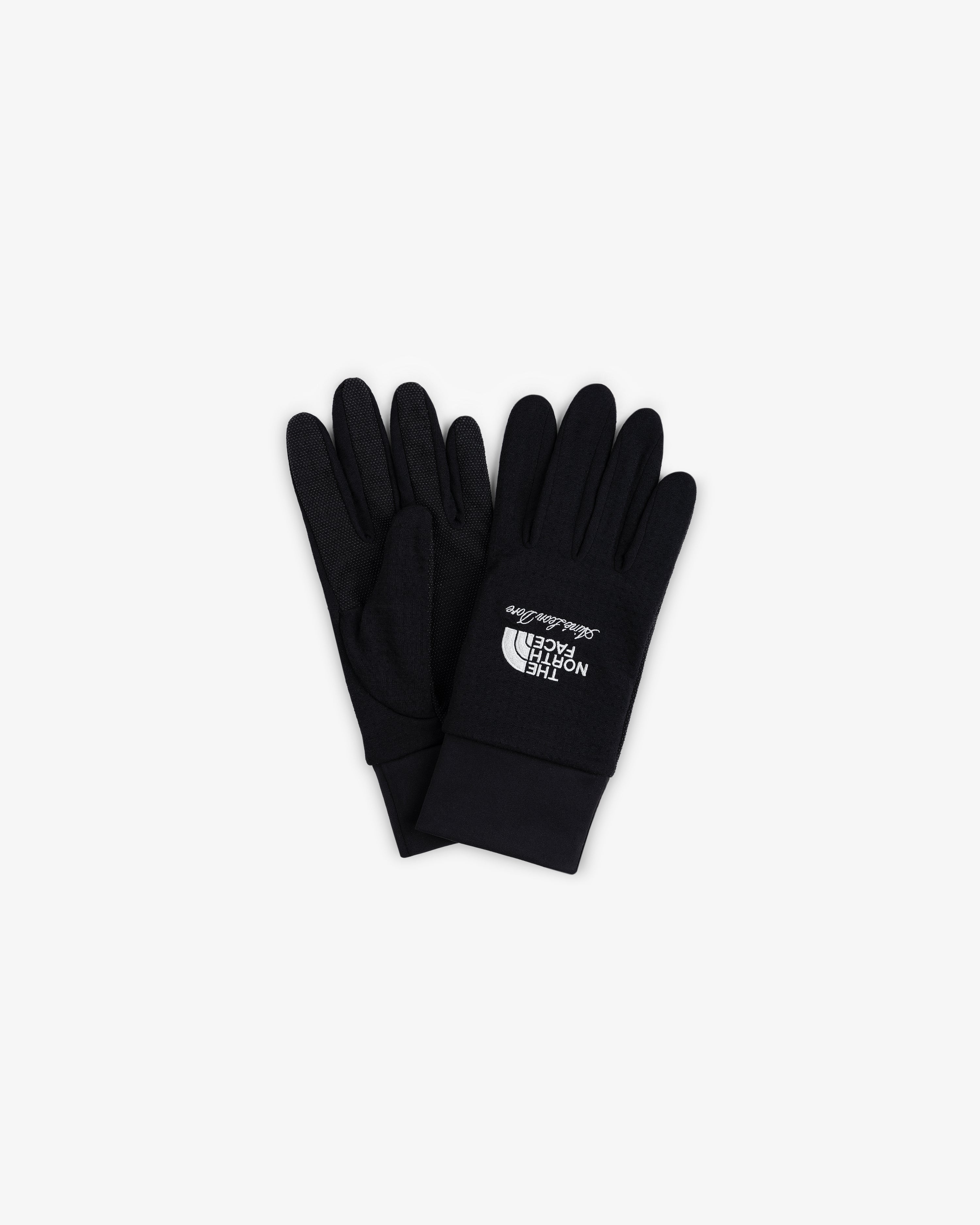 ALD / The North Face DOTKNIT™ Liner Gloves in black with white logo, stacked on a white background.