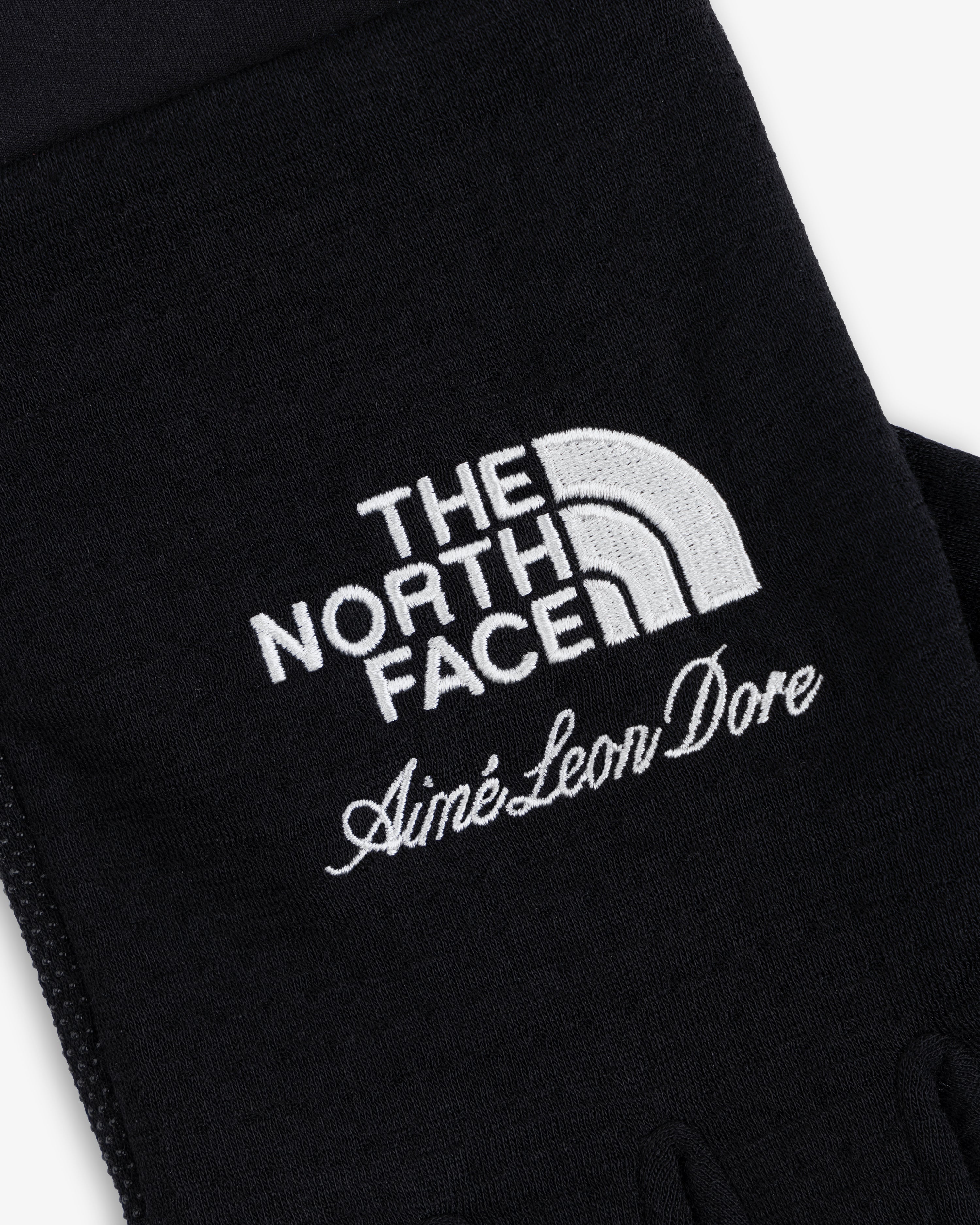 ALD / The North Face DOTKNIT™ Liner Gloves in black with white embroidered logos.