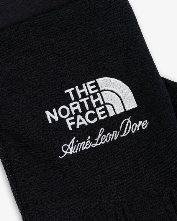 ALD / The North Face DOTKNIT™ Liner Gloves in black with white embroidered logos.