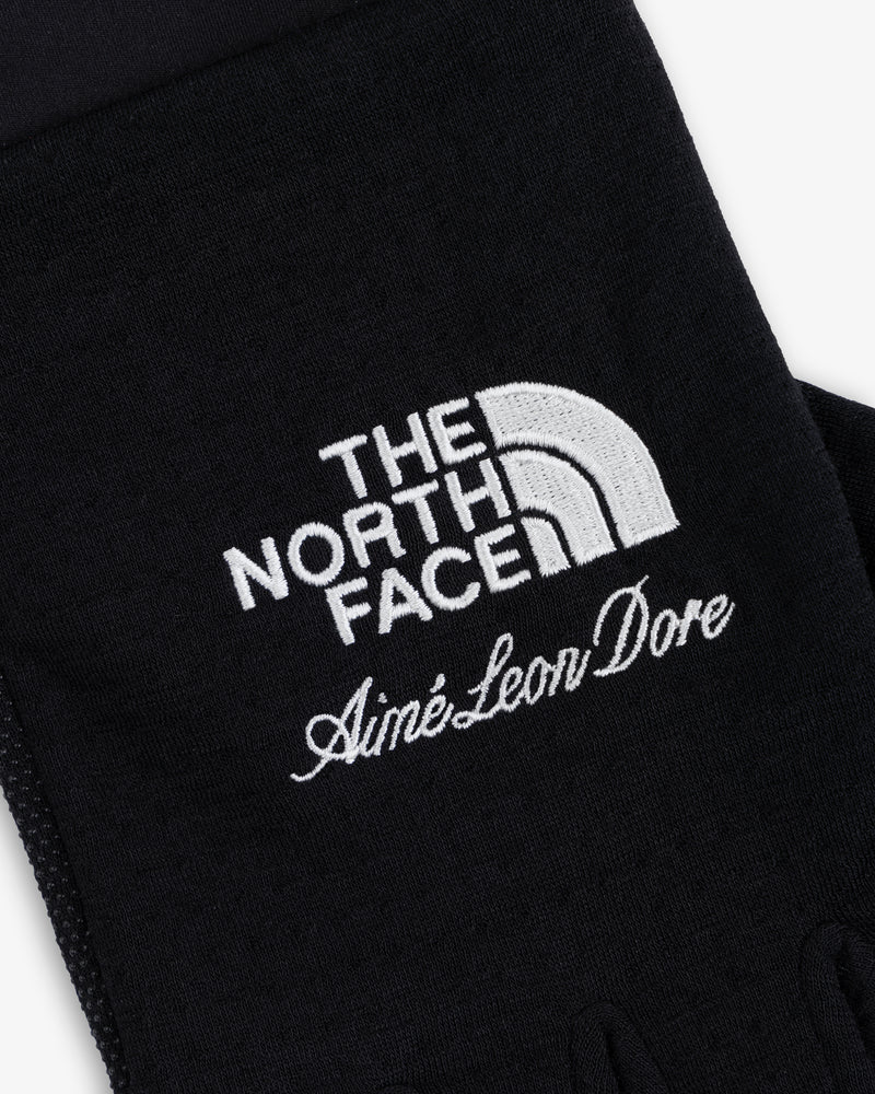 ALD / The North Face DOTKNIT™ Liner Gloves in black with white embroidered logos.