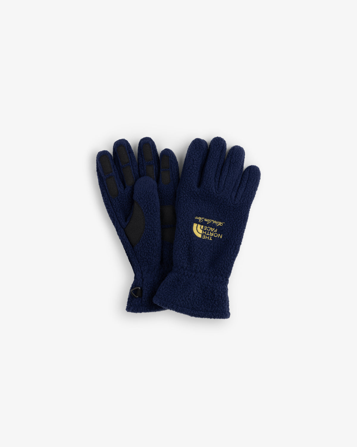 ALD / The North Face navy fleece gloves with black grips and yellow logo on the back of one glove.