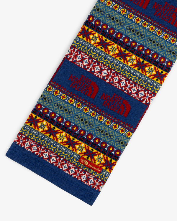ALD / The North Face Fair Isle Scarf in blue, yellow, red & white with red logo, shown on white background.