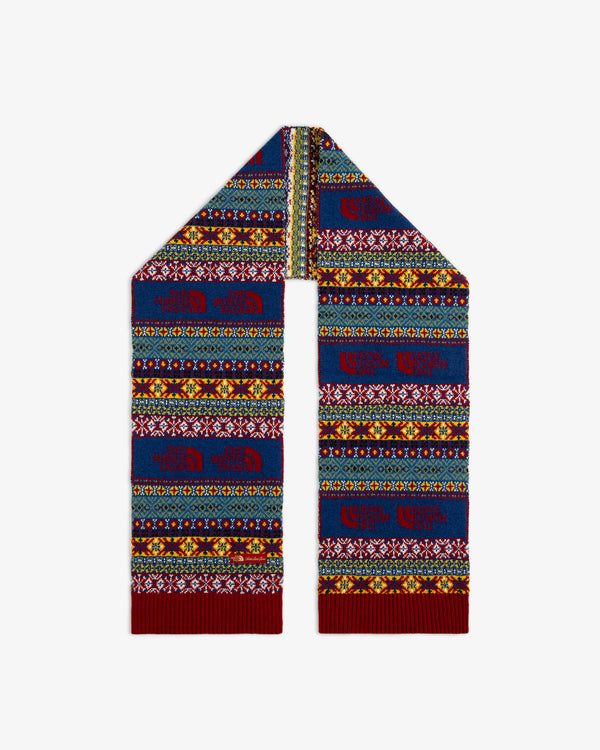 ALD / The North Face Fair Isle scarf with blue, yellow, and red geometric patterns and repeating logos.