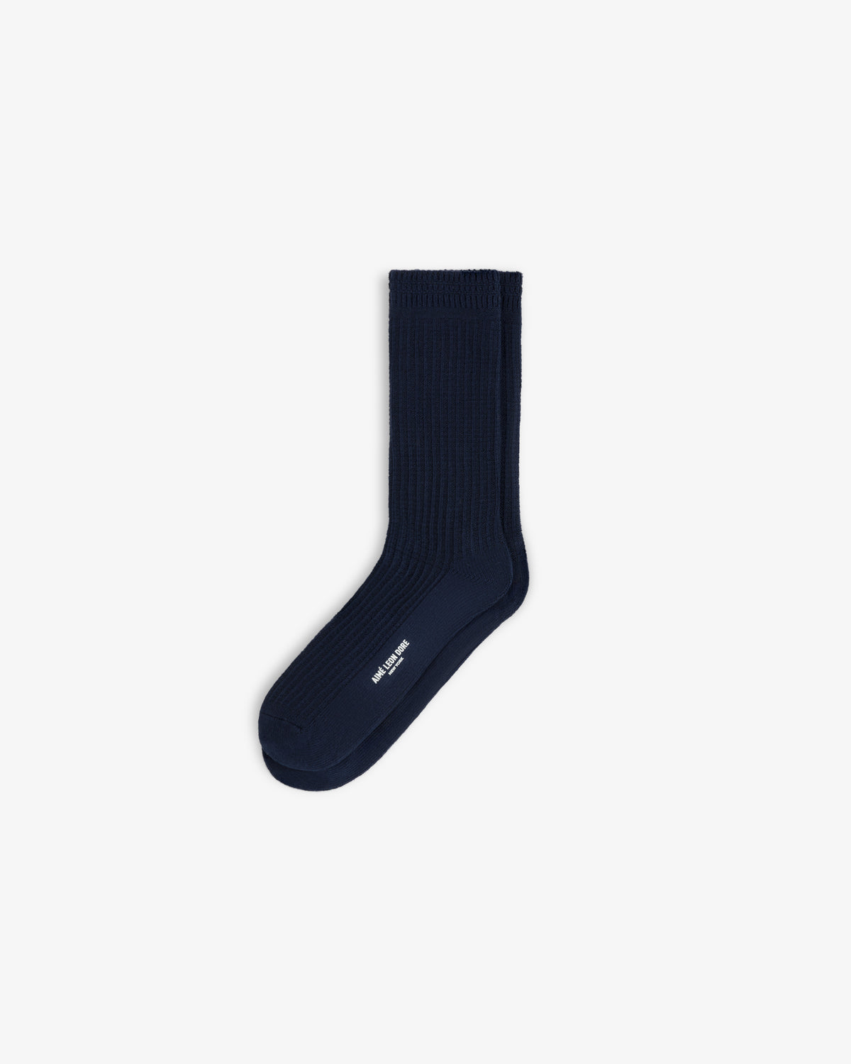 A navy blue ribbed Cotton Waffle Sock with white logo text on the side.