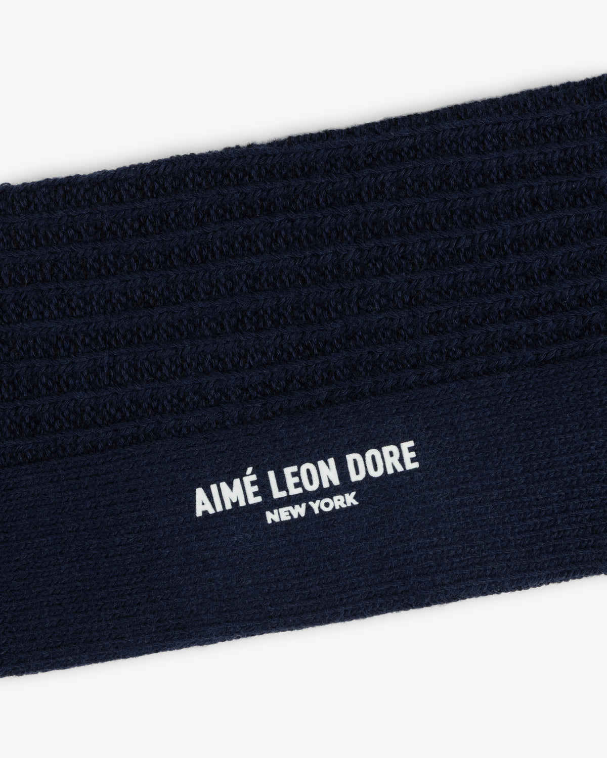 Dark navy blue Cotton Waffle Sock cuff with ribbed texture and white Aimé Leon Dore New York text.