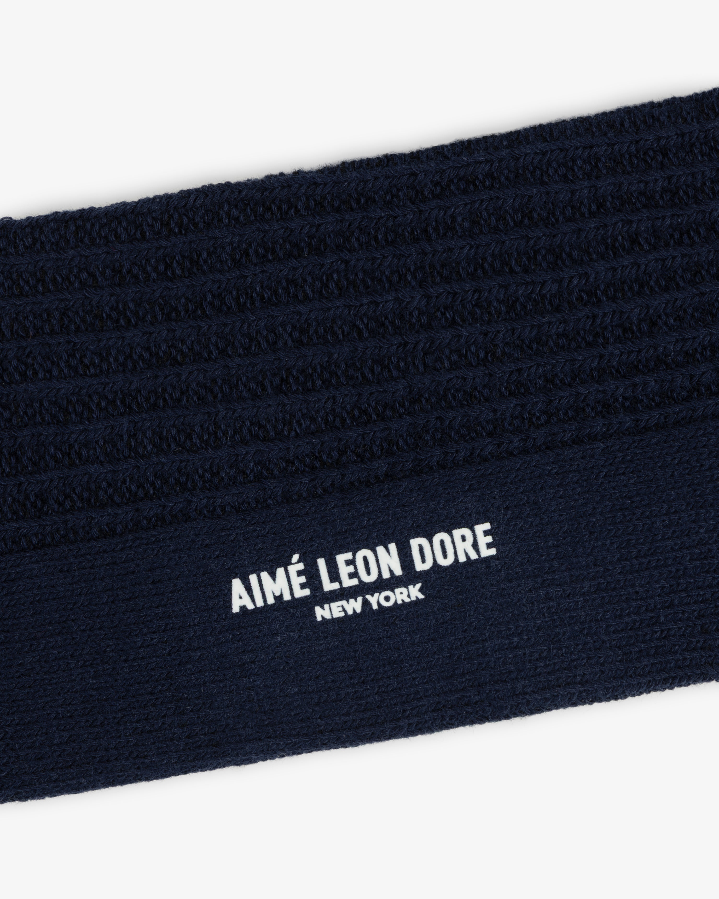 Dark navy blue Cotton Waffle Sock cuff with ribbed texture and white Aimé Leon Dore New York text.
