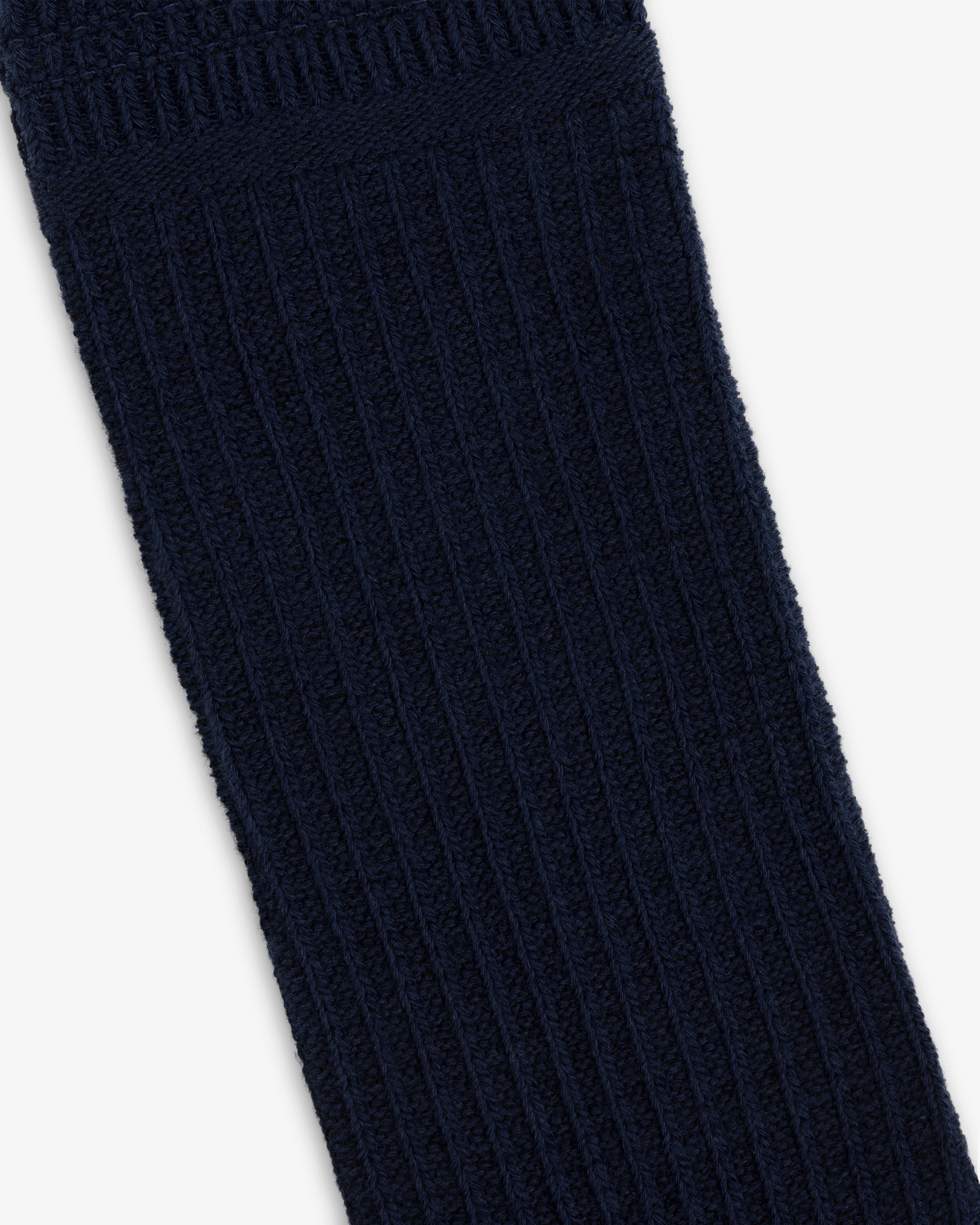 A dark blue Cotton Waffle Sock with a ribbed knit texture.