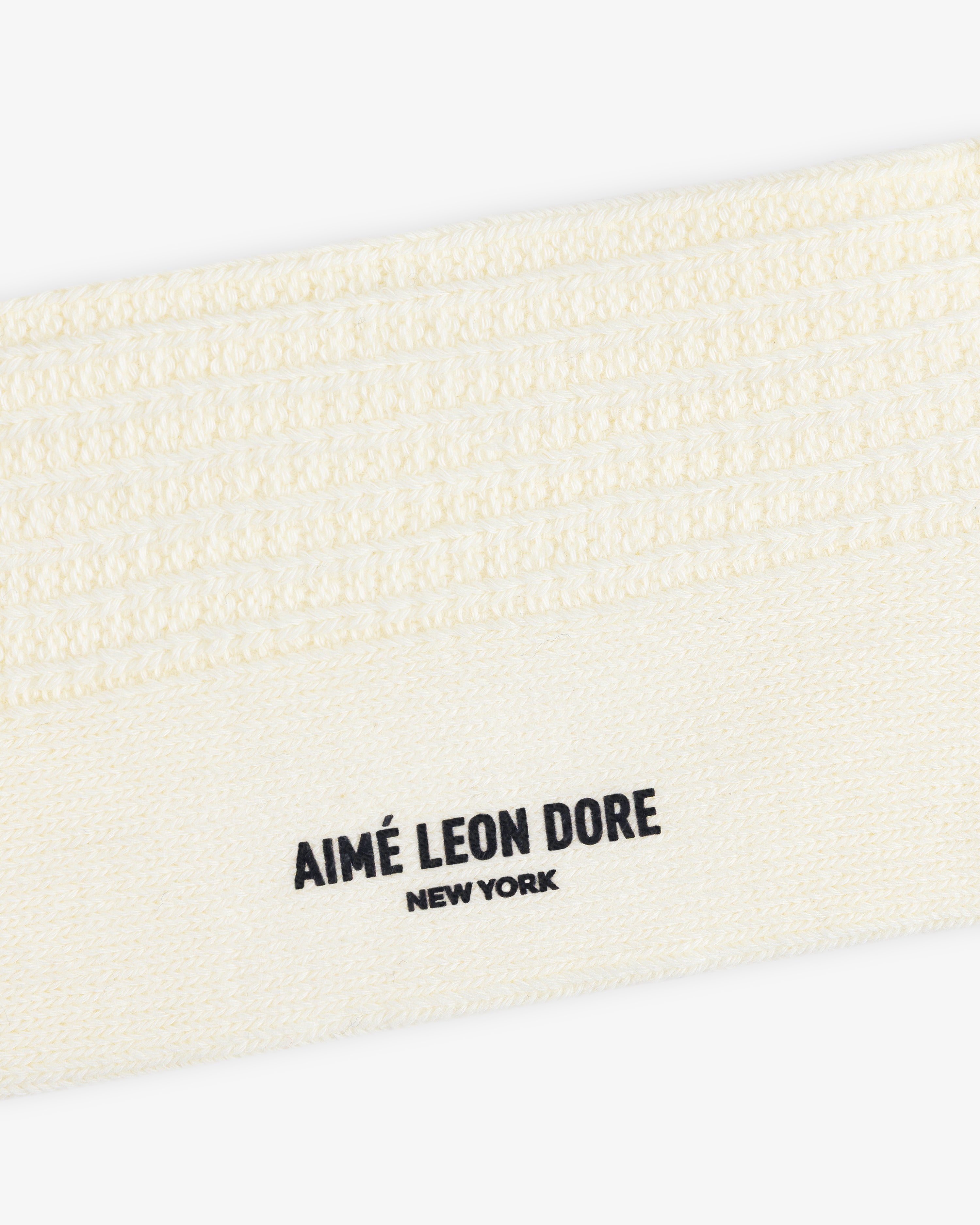 Off-white ribbed Cotton Waffle Sock with Aimé Leon Dore New York printed in black.