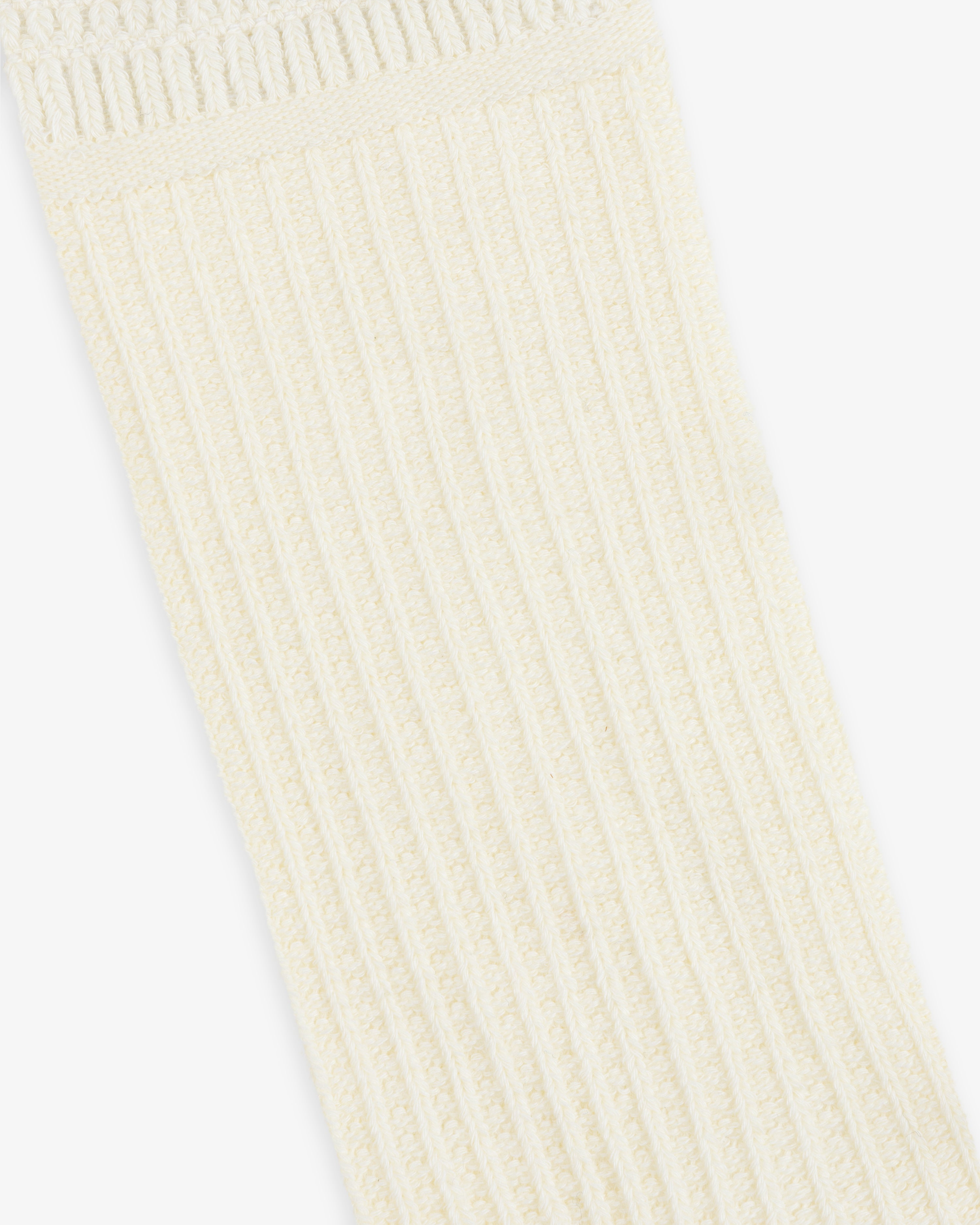 Off-white Cotton Waffle Sock with a vertical ribbed texture and a waffle-knit cuff.