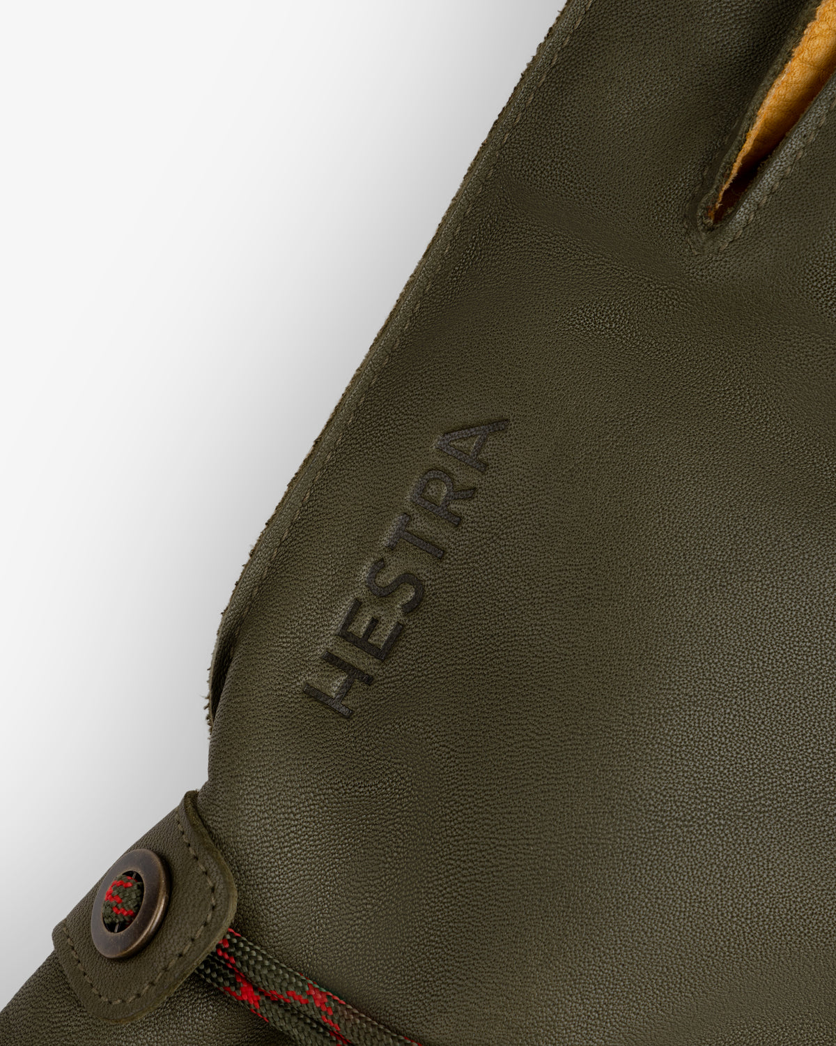Olive green Wakayama Gloves with a snap closure and the brand name embossed on the wrist.