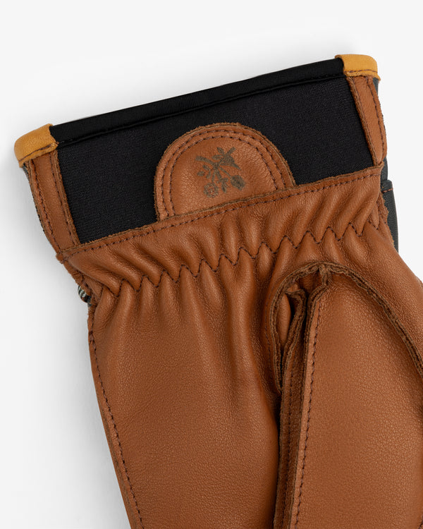 Wakayama Gloves featuring brown leather, a black elastic cuff, and a small embossed logo.