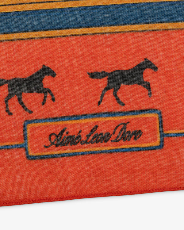 Bayard Silk Bandana in red, featuring black horse silhouettes and Aimé Leon Dore text in a bordered rectangle.