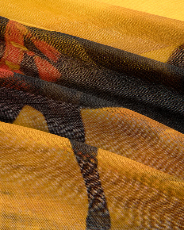 Close-up of the Bayard Silk Bandana, featuring a camel and saddle on a yellow-brown desert background.