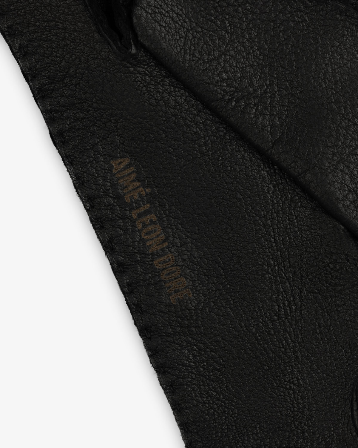 Black Henry Gloves leather glove with an embossed logo along the stitched edge.